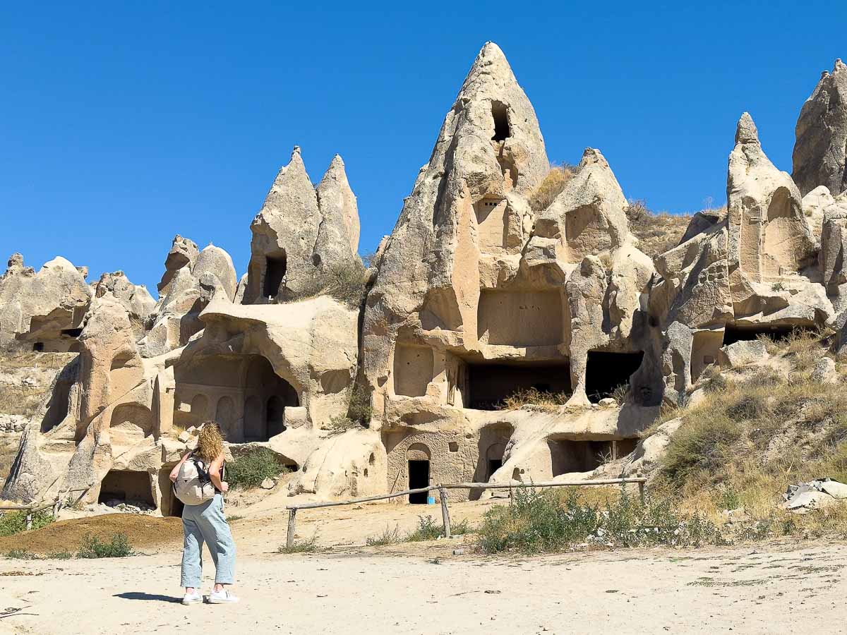 Nina on a sunny day looking at crazy rock landscape in Cappadocia.