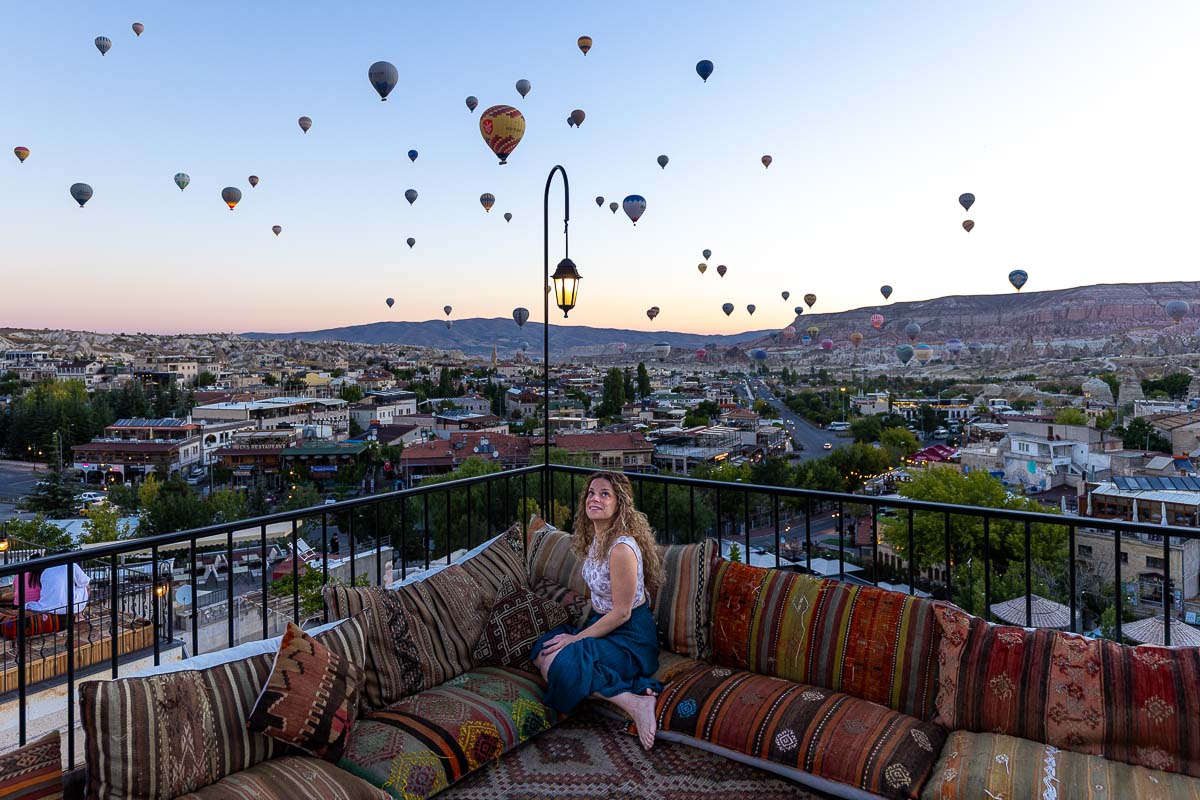 Nina in Cappadocia with hot air balloons everywhere.