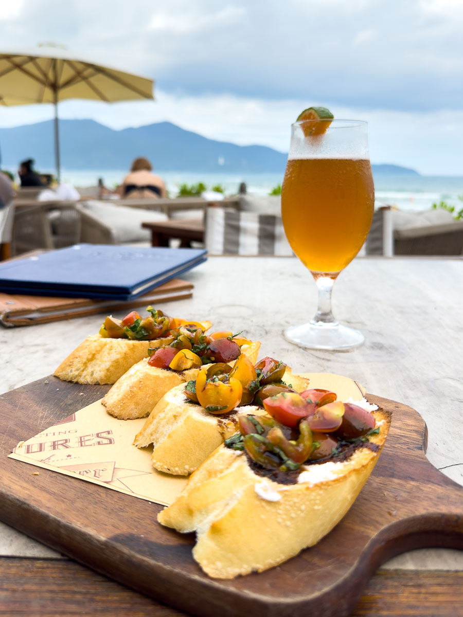 Bruchetta and beer on the beach.
