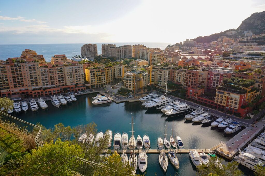A breathtaking aerial view of Monaco's harbor lined with yachts and colorful buildings.