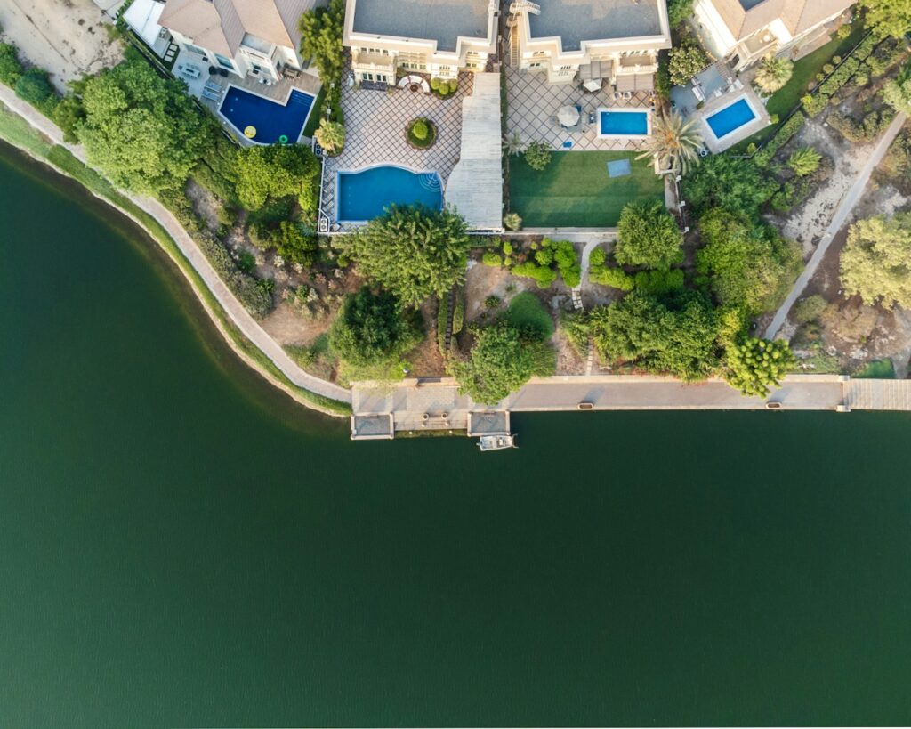 an aerial view of a house with a swimming pool
