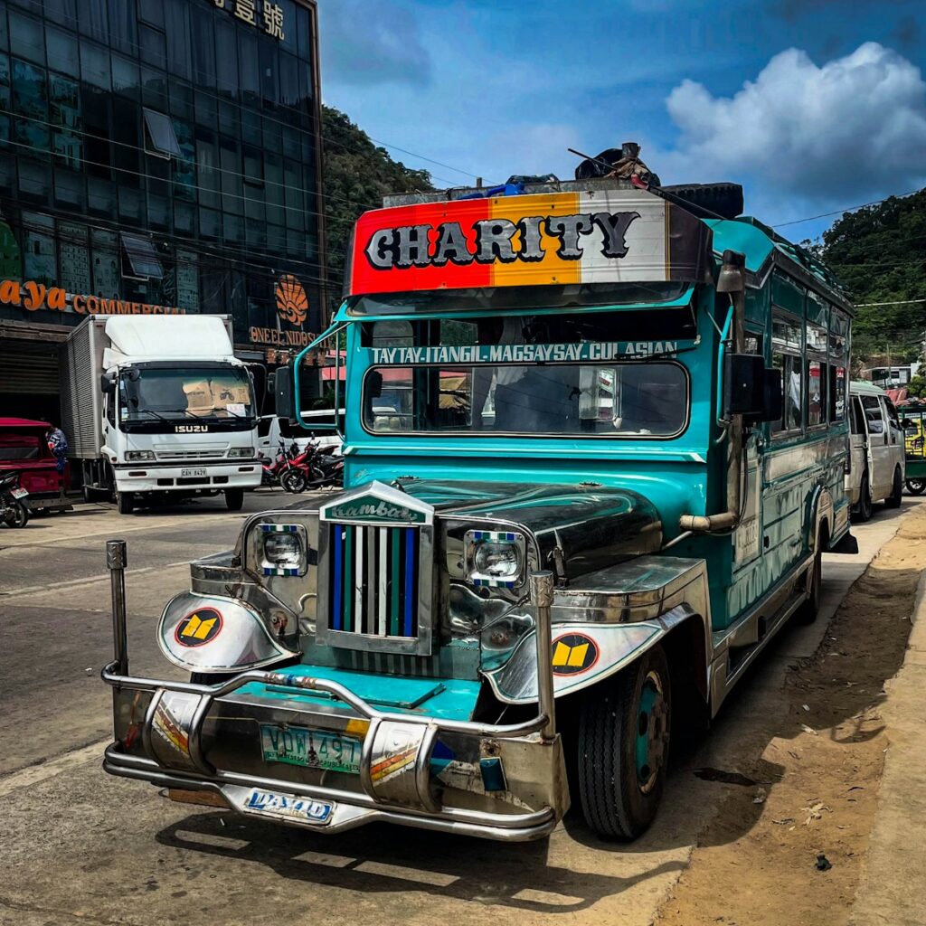 A colorful jeepney is parked on the street.