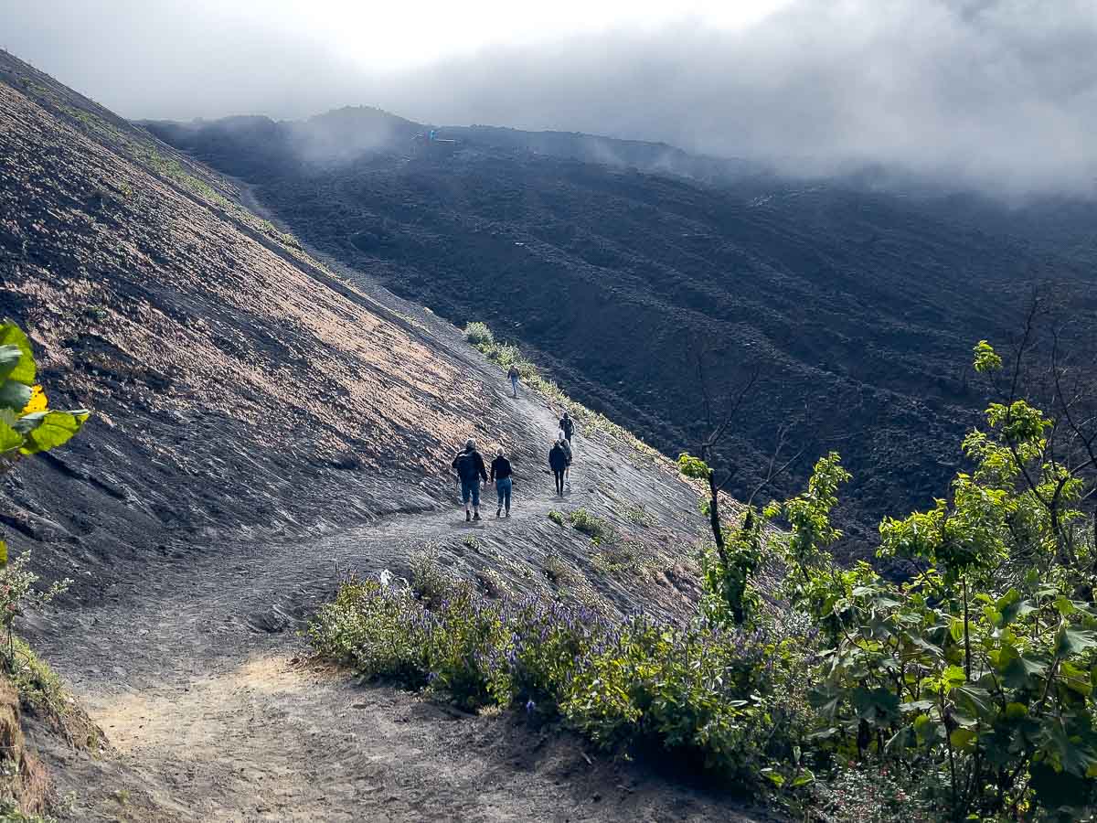 Hikers rounding a corner on the Pacaya Volcano hike.