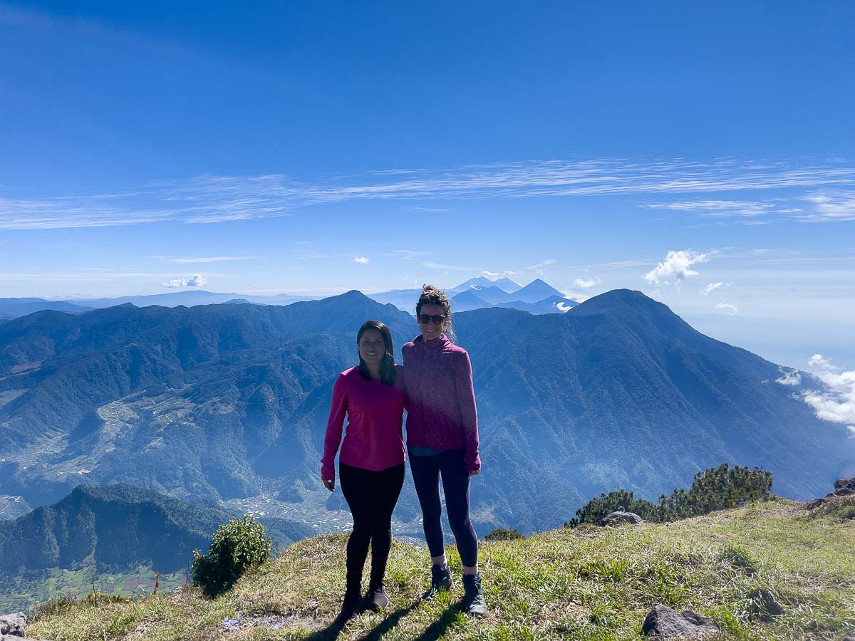 nina and friend at summir with mountain view behind.