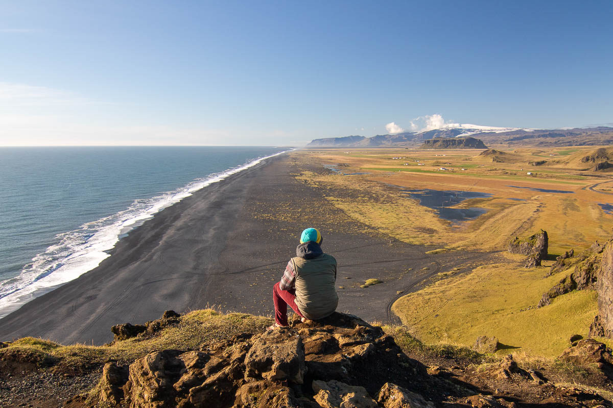 Garrett overlooking cliff at Dyrhólaey Vik Beach