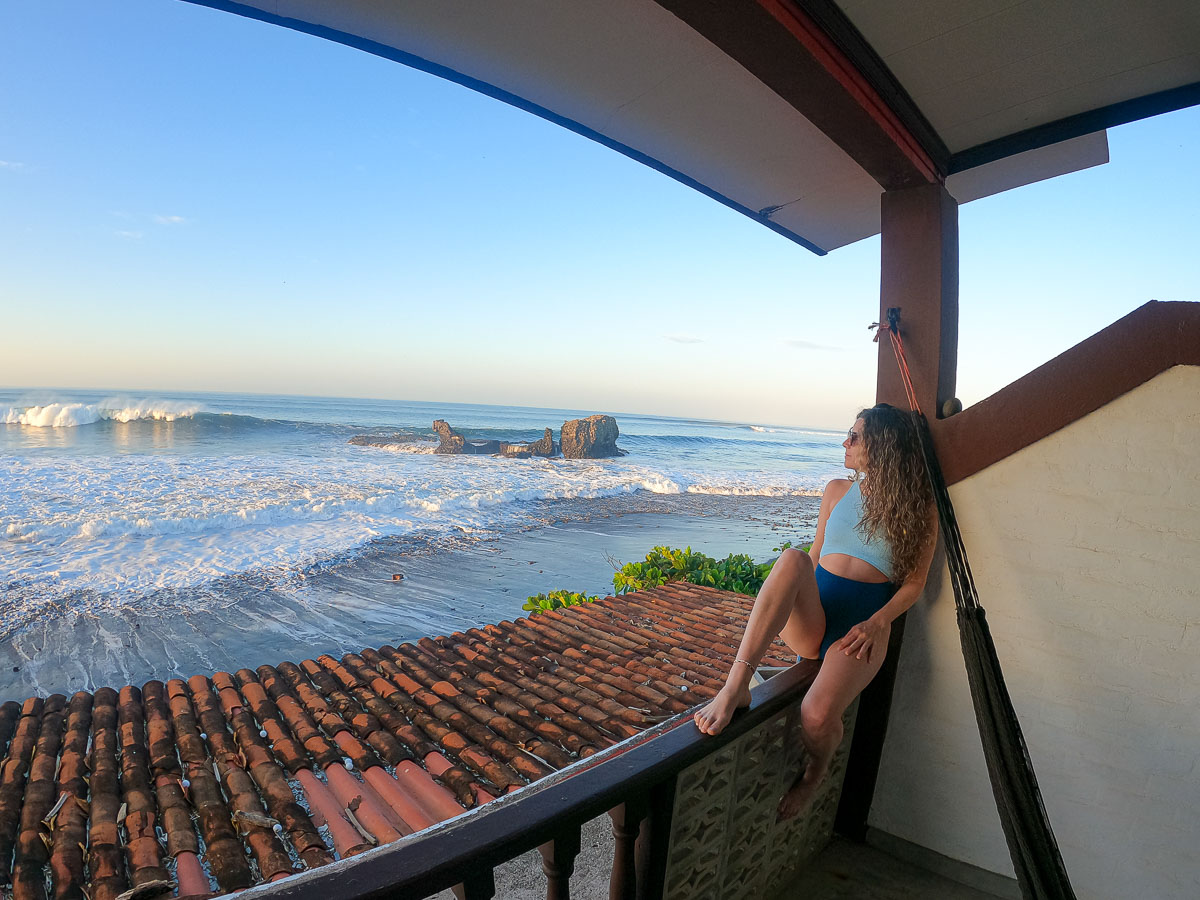 Nina looking at rock view from her balcony.