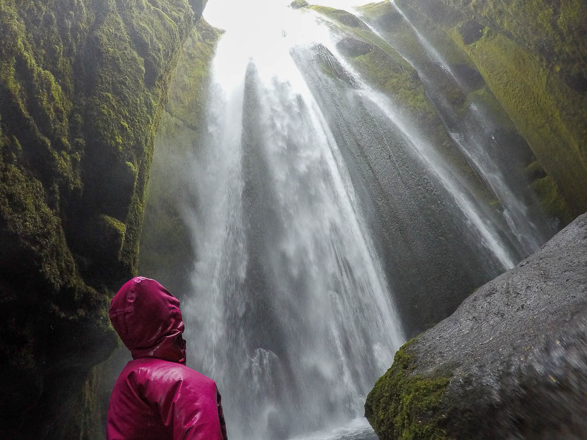 Nina under the Gljufrabui waterfall.