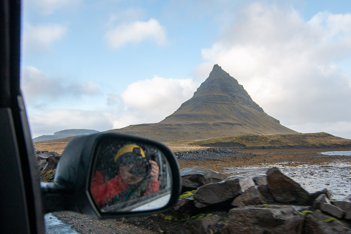 Driving up to Kirkjufell, photo of mountain and car mirror.