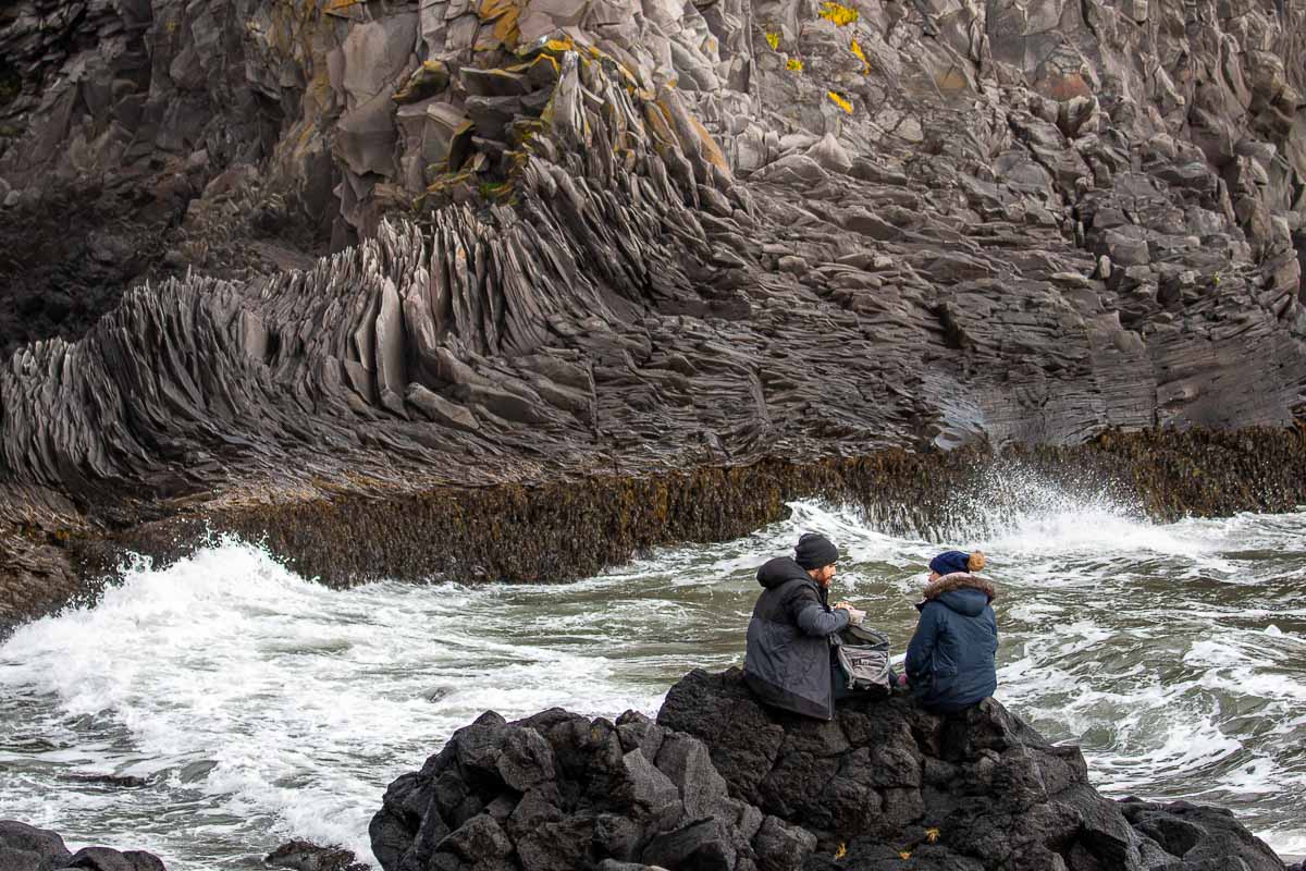 Iceland couple on rock.