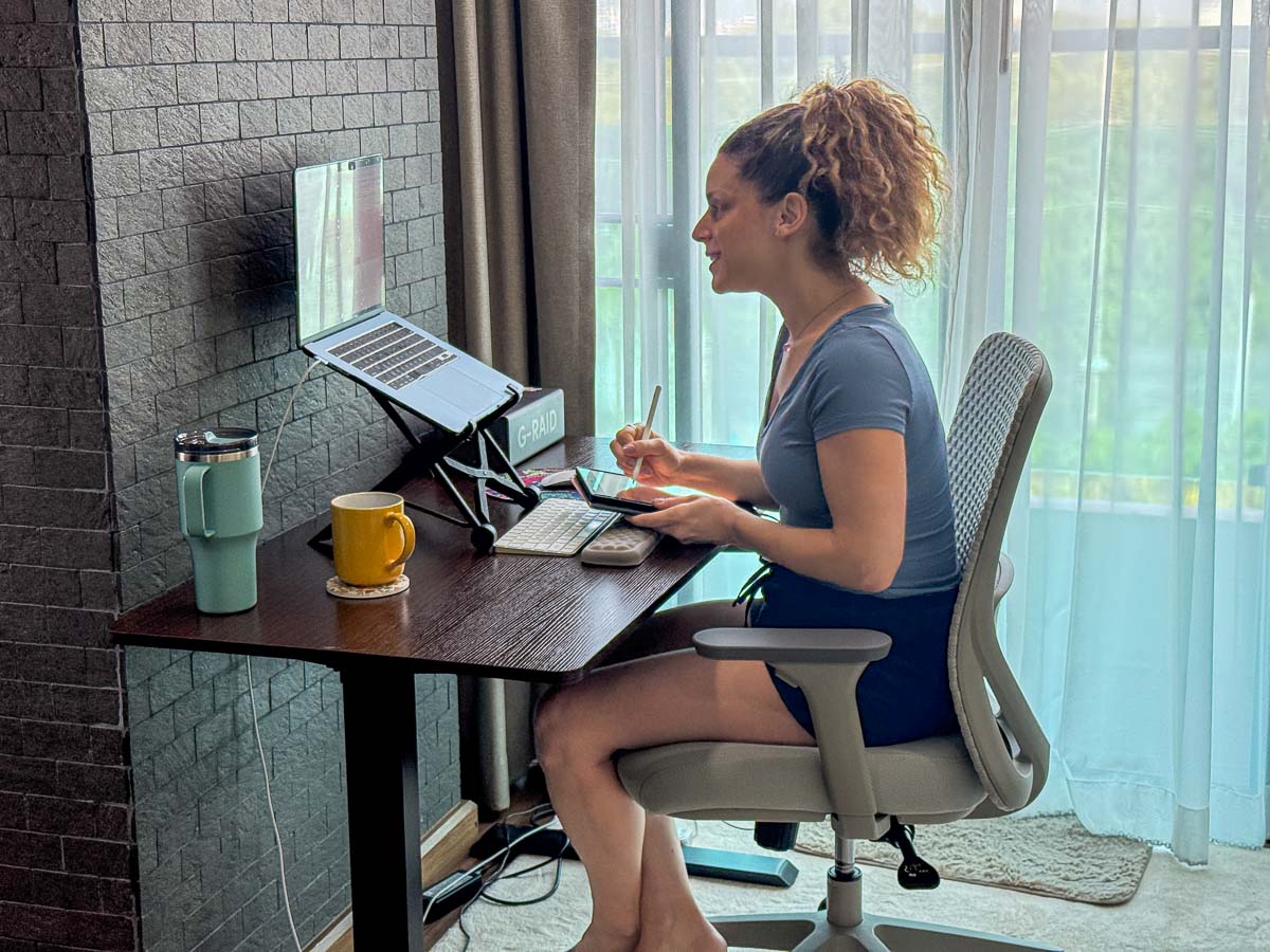 Nina doing a Preply class online sitting at a desk.