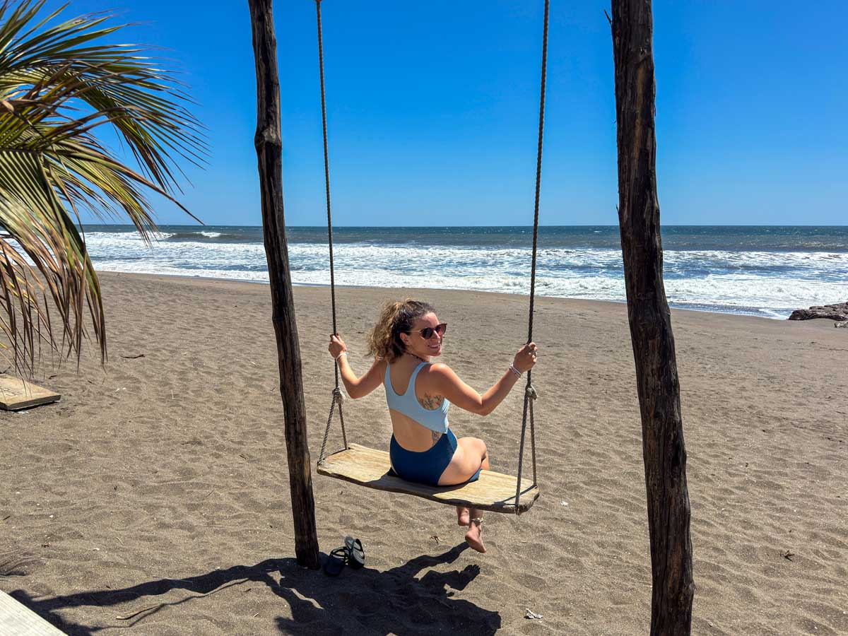Nina on a swing at Las Peñitas beach, Nicaragua