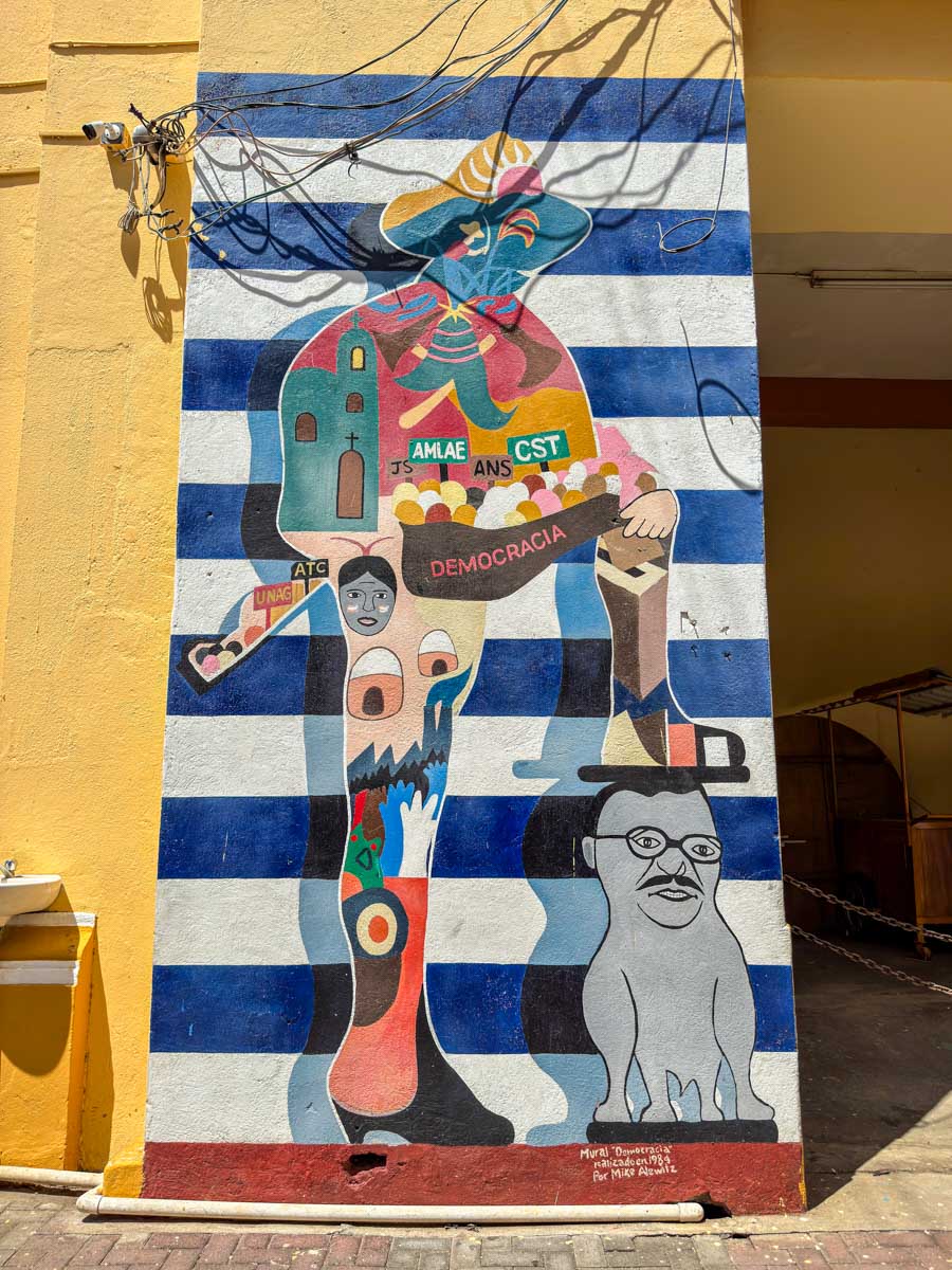 Street mural on a colorful wall in León, Nicaragua
