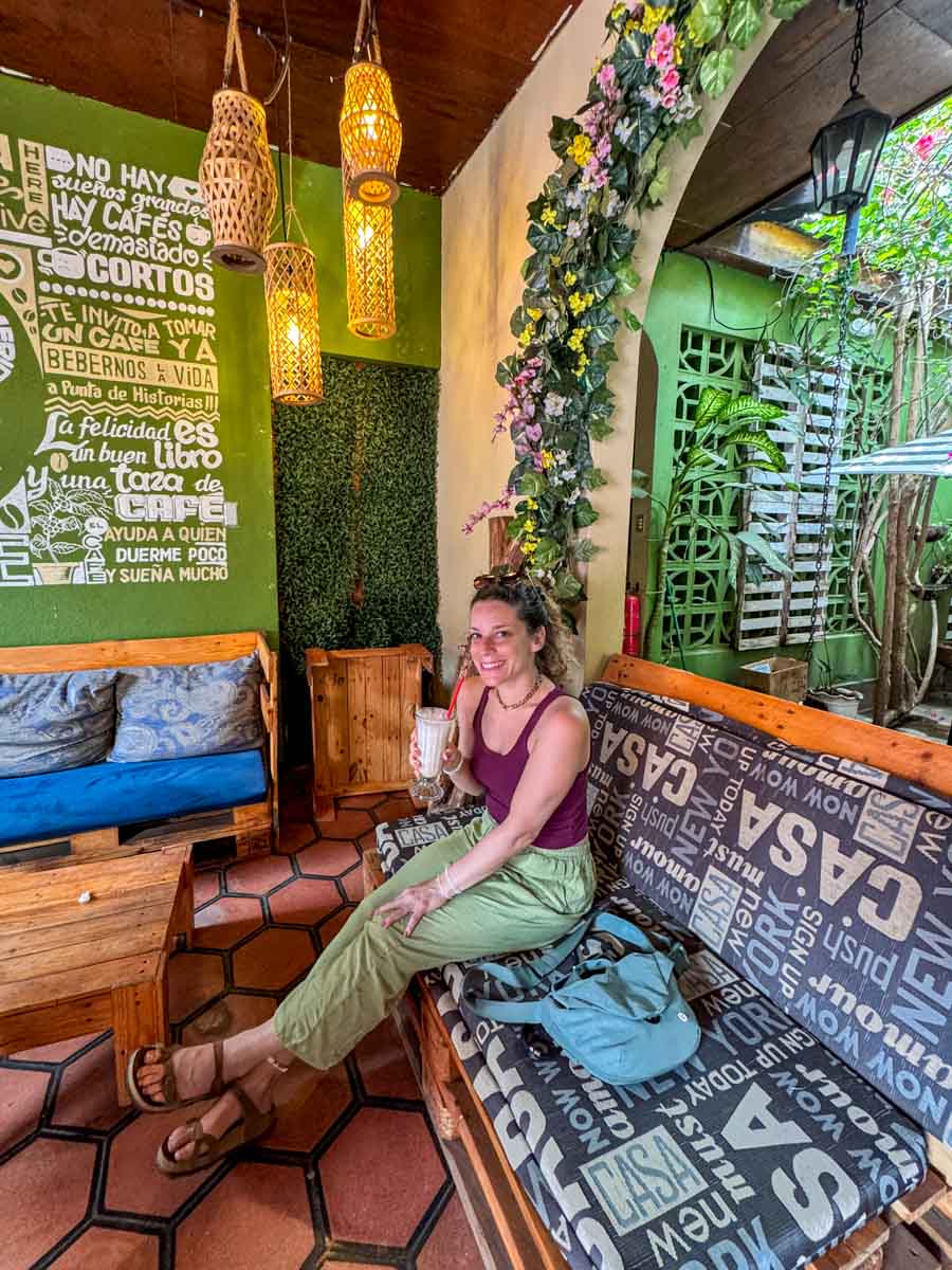 Nina drinking coffee at a café in León, Nicaragua