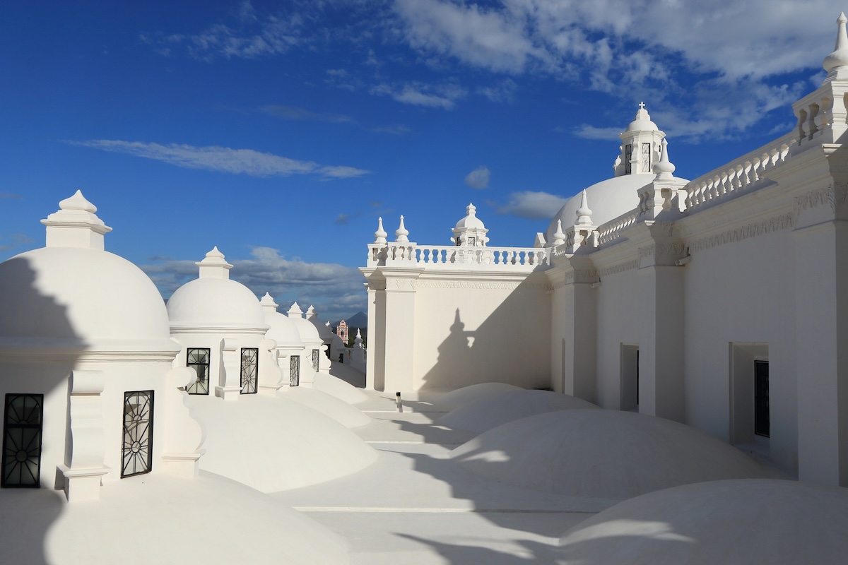 White rooftop of León Cathedral with volcano views, Nicaragua