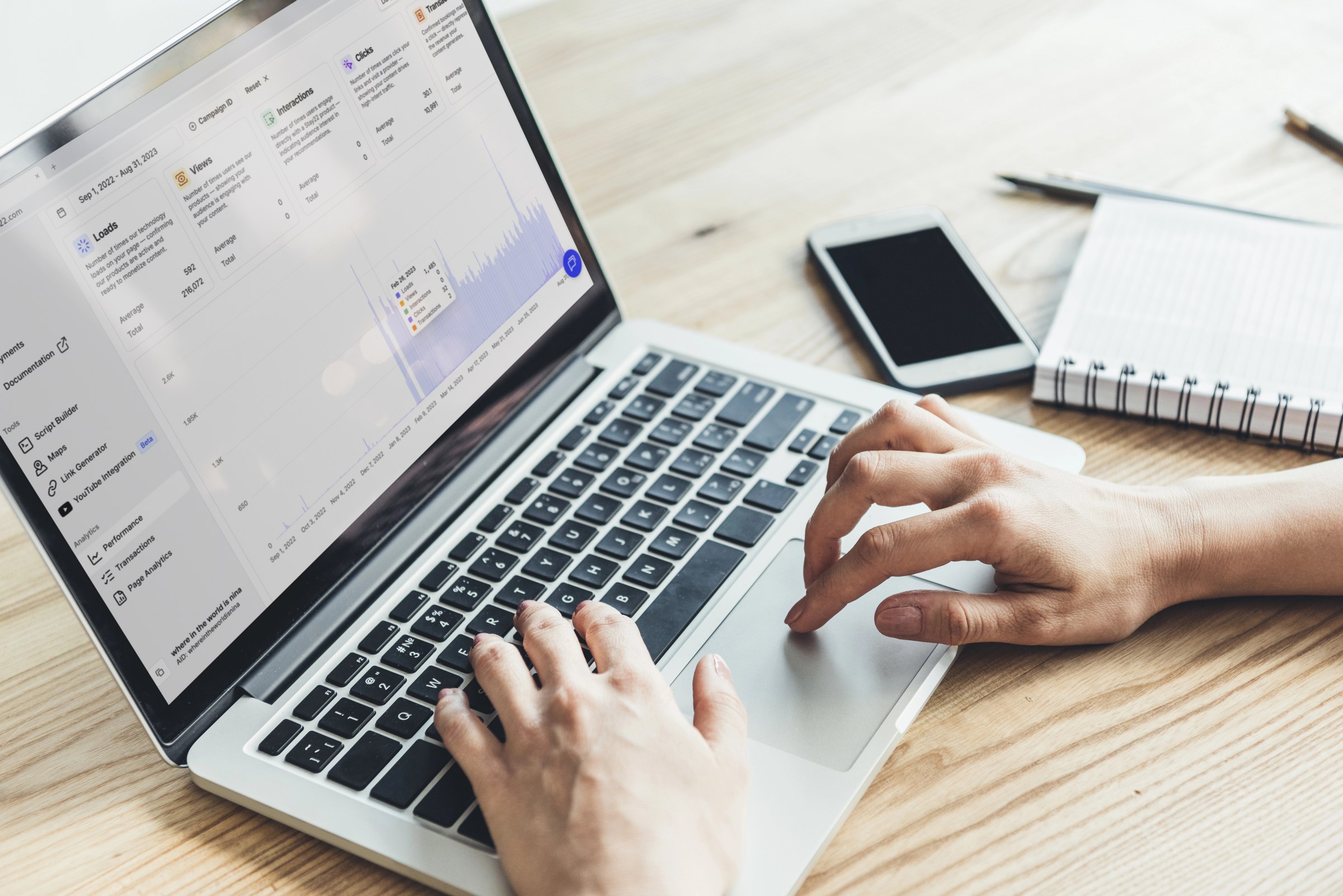 Stay22 review data and stats on a laptop.