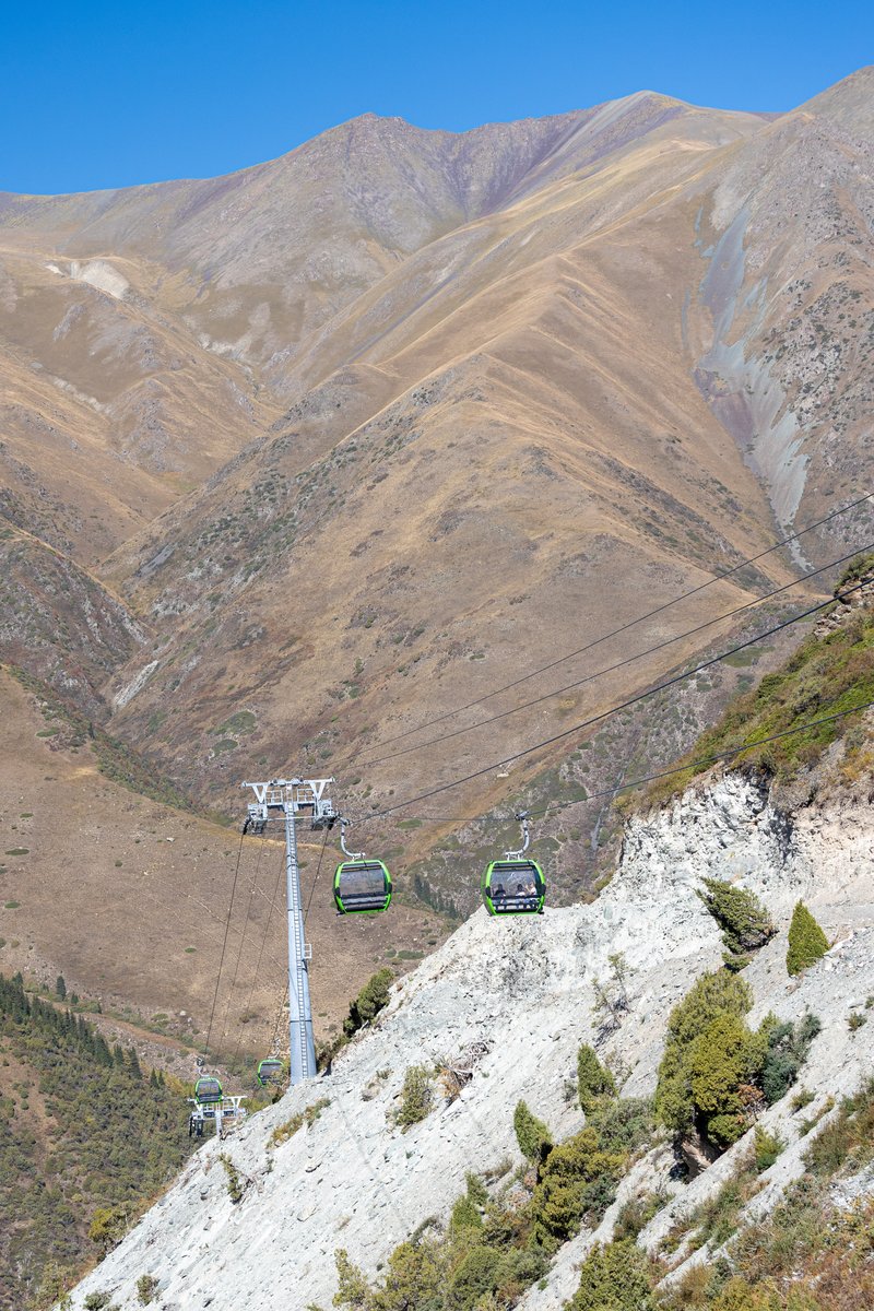 Gondola cabins climbing the valley at Ala Archa National Park, Kyrgyzstan