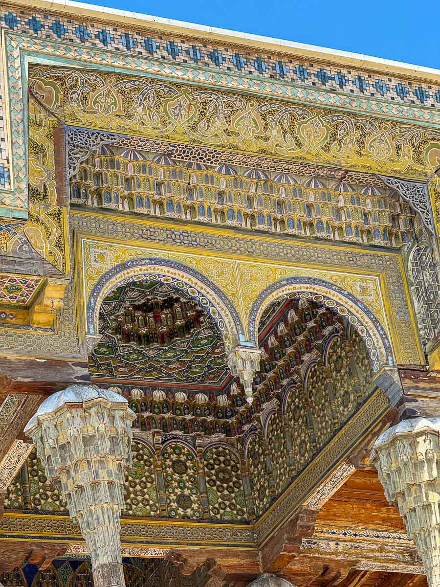 Carved wooden pillars at Bolo Hauz Mosque in Bukhara, Uzbekistan