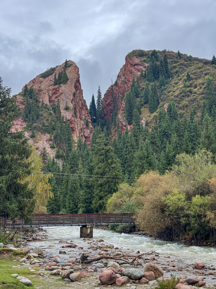 Broken Heart Rock split in two above a river in Jeti-Oguz, Kyrgyzstan