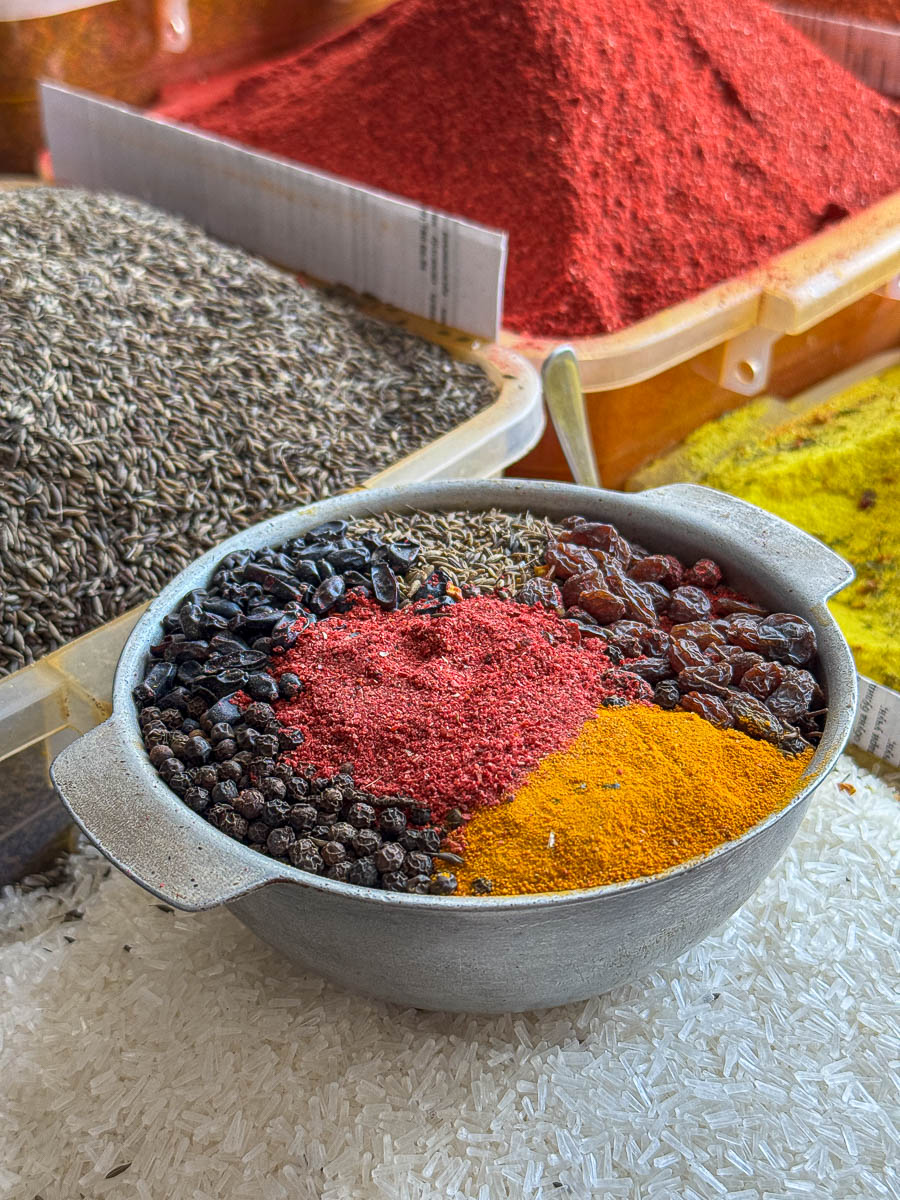 Bowls of colorful spices for sale at Chorsu Bazaar in Tashkent, Uzbekistan