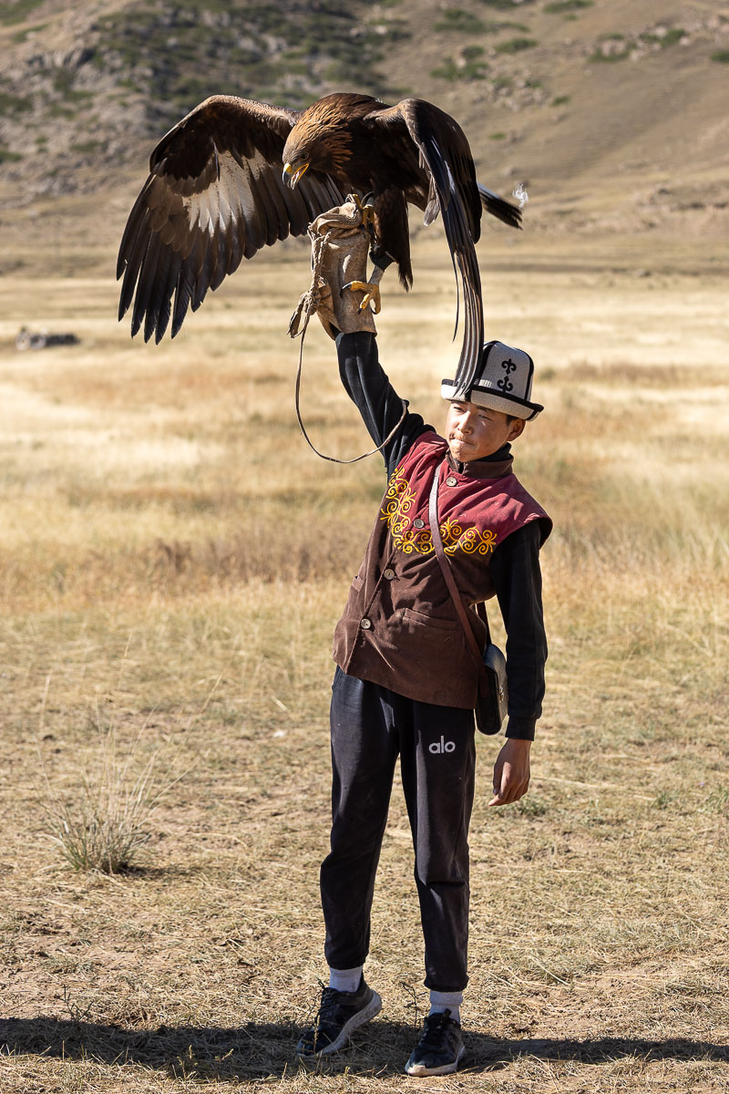 Young eagle hunter in traditional dress, Kyrgyzstan