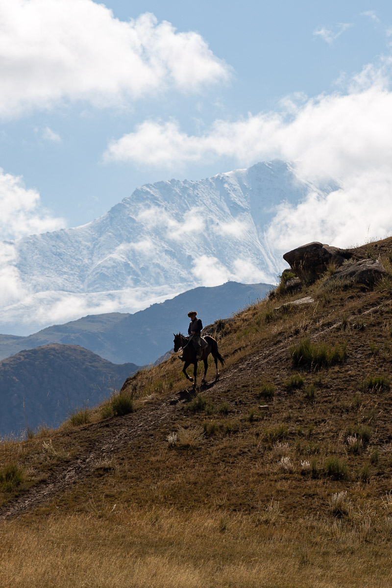 Eagle hunter on horseback in the mountains of Kyrgyzstan
