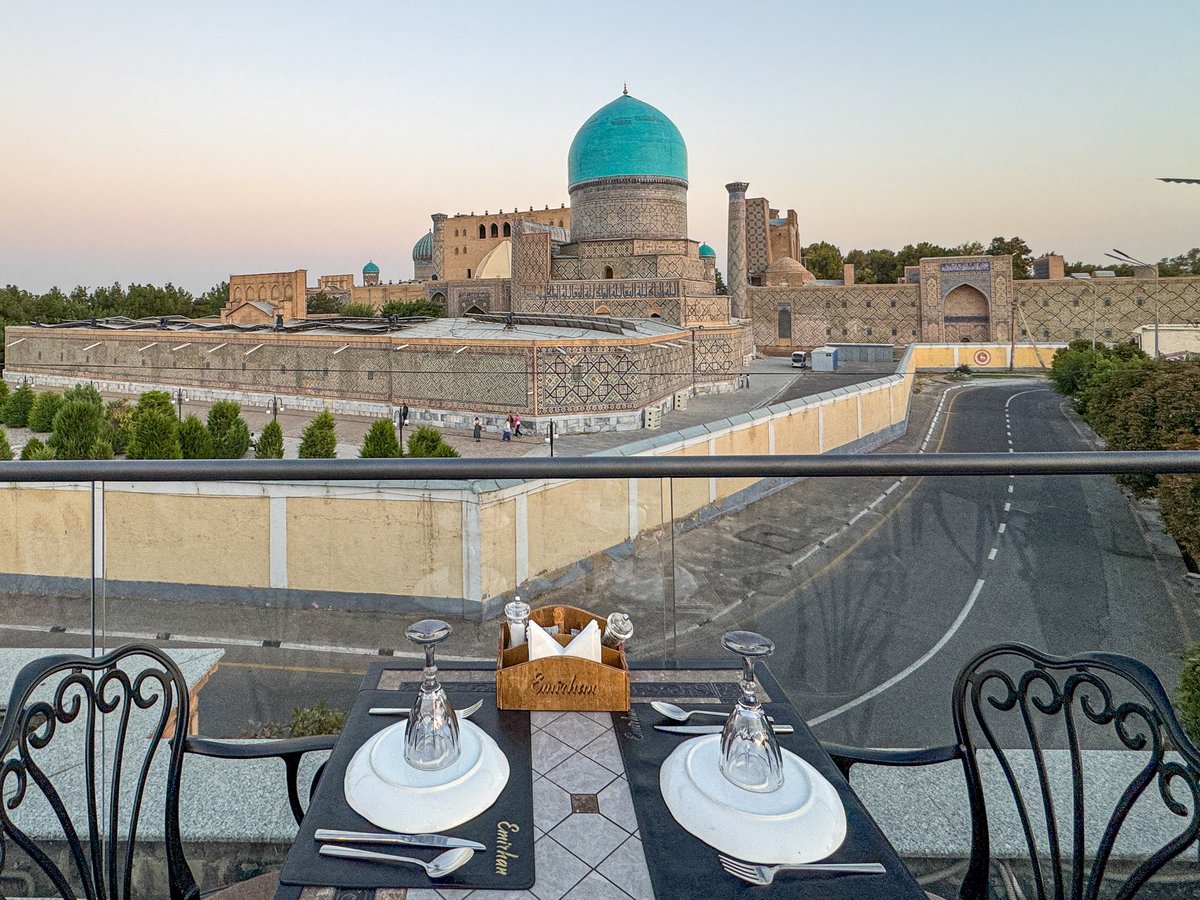 Rooftop dinner table at Emirhan Restaurant with a blue dome view in Samarkand, Uzbekistan
