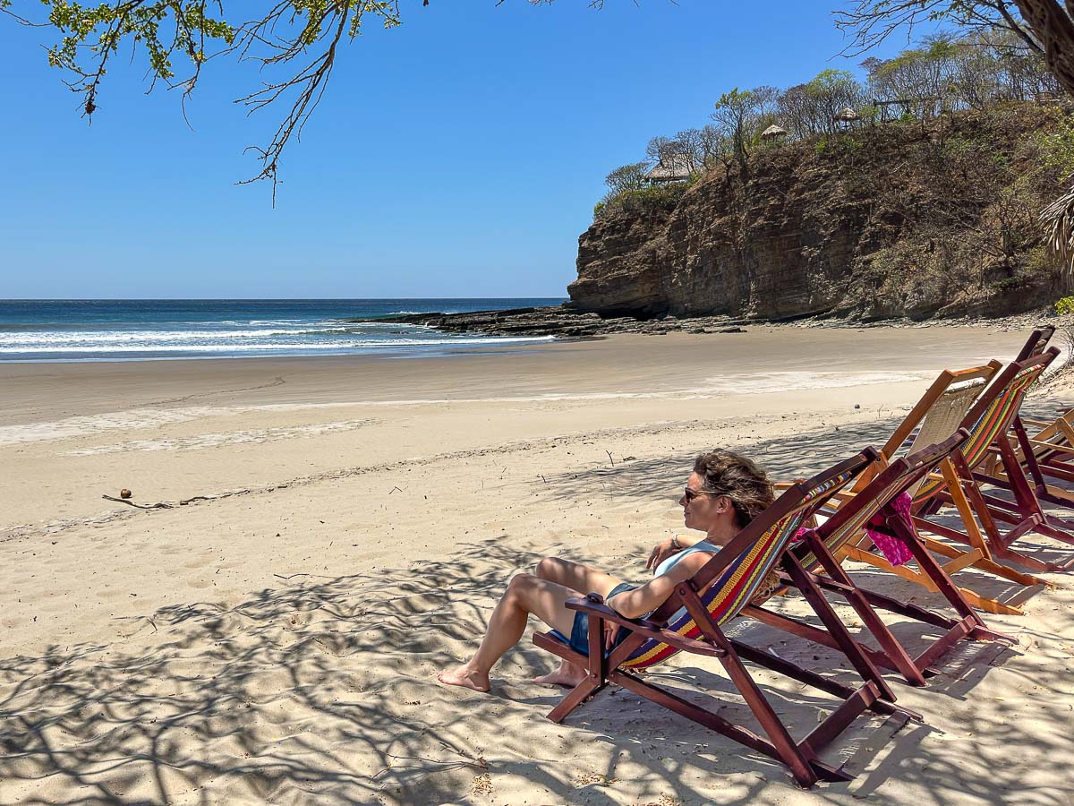 Nina relaxing in a beach chair at Playa Escameca, Nicaragua