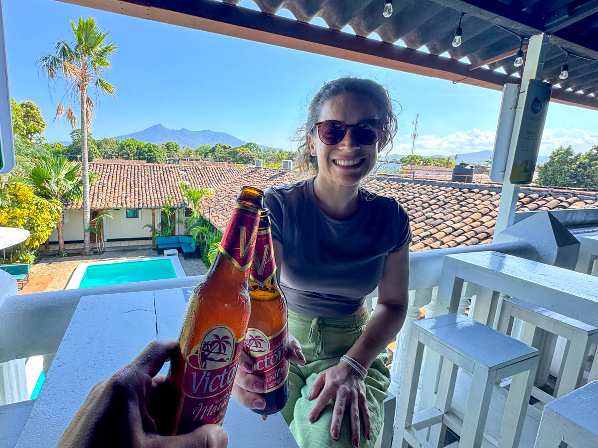 Cheersing beers at a rooftop bar in Granada, Nicaragua