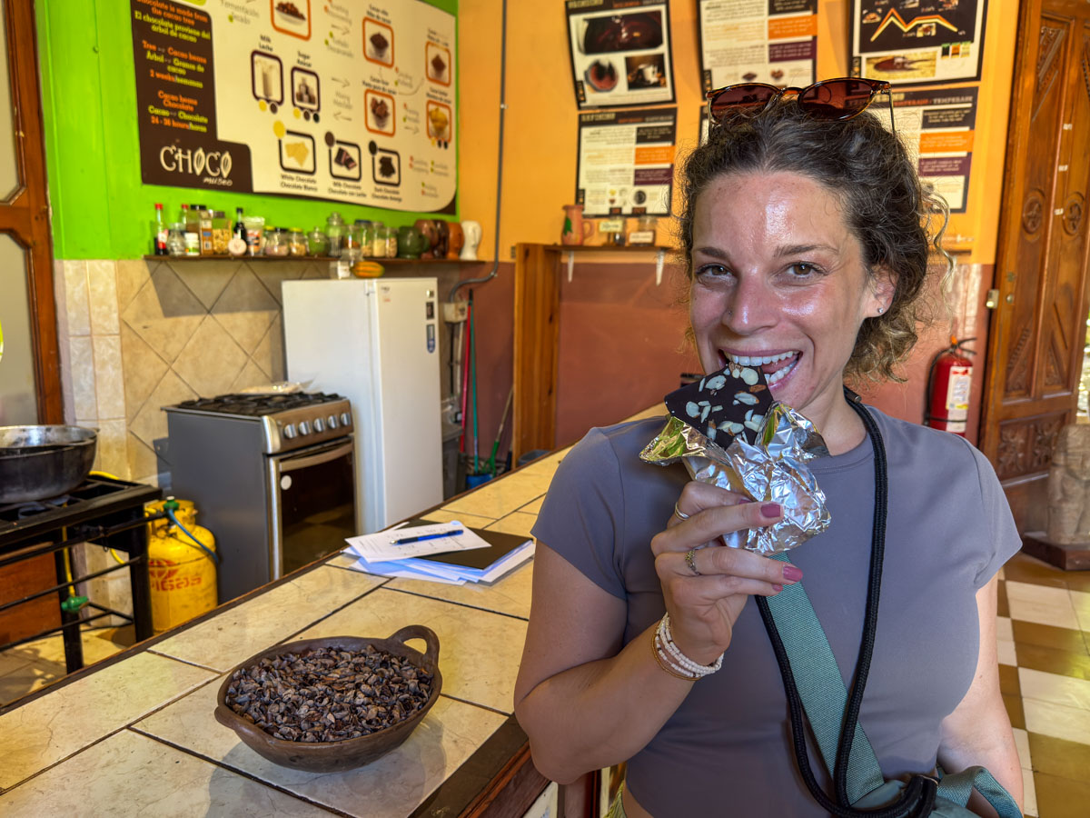 Nina eating the chocolate bar she made at ChocoMuseo Granada