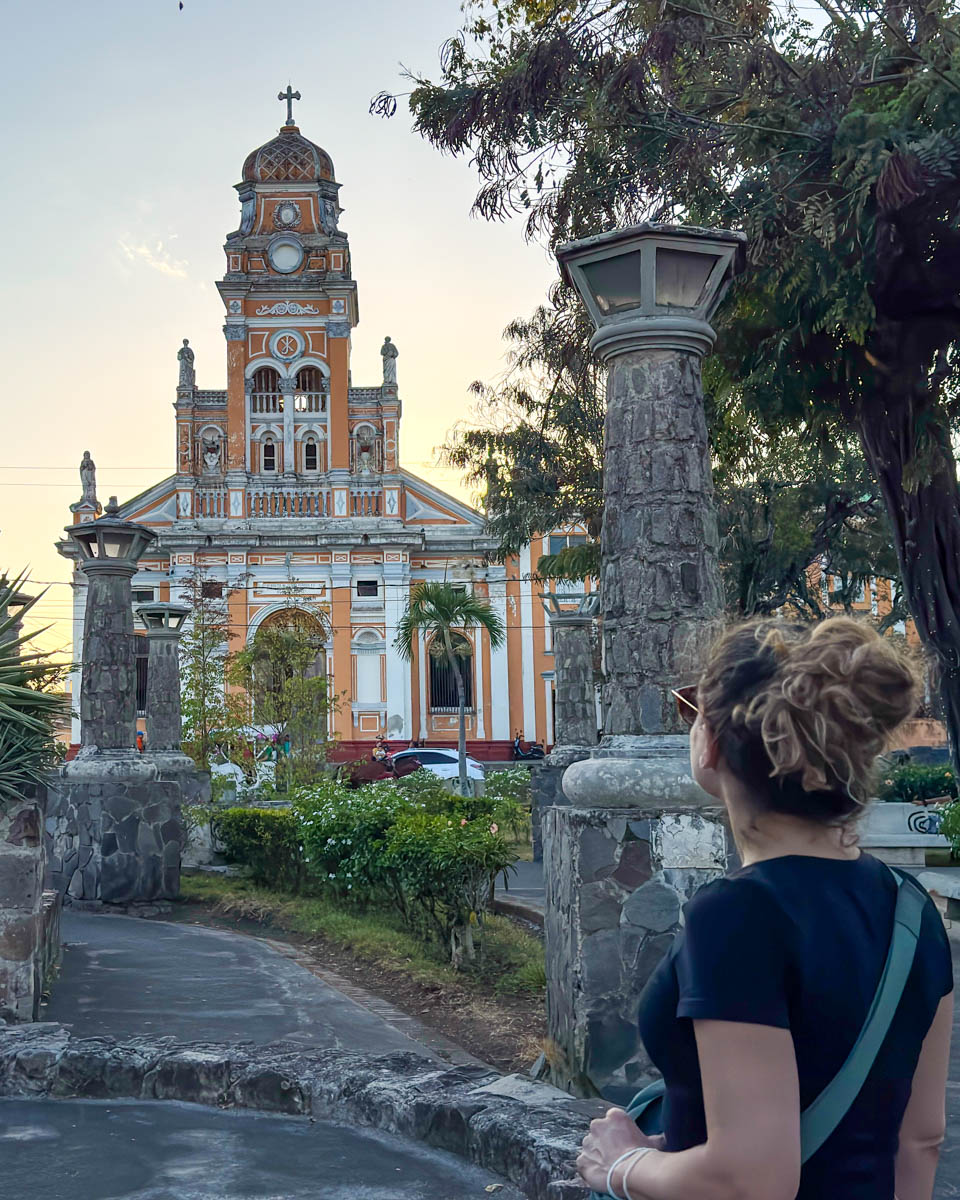 Nina in front of a colonial church in Granada, Nicaragua