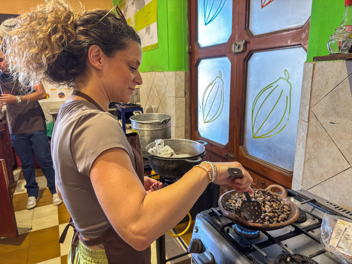 Nina mixing cacao during the chocolate-making class at ChocoMuseo, Granada