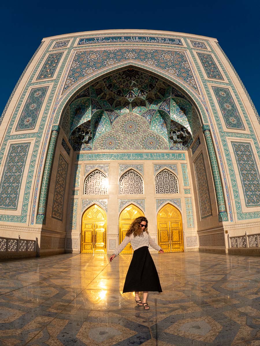 Nina walking toward the arch at the Hazrati Imam Complex in Tashkent, Uzbekistan
