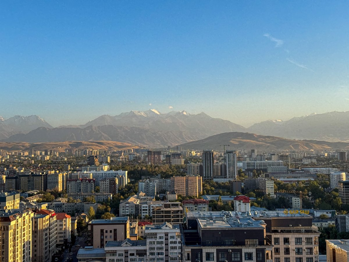 View over Bishkek with snowcapped mountains from IWA Sky Bar, Kyrgyzstan