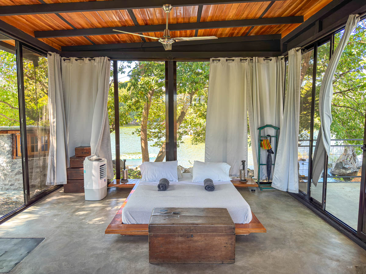 Bed inside the glass house on Isla Mirabel, Nicaragua