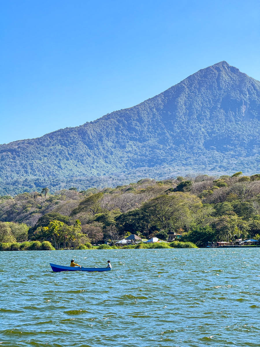 Boater passing through Las Isletas de Granada with Mombacho Volcano behind