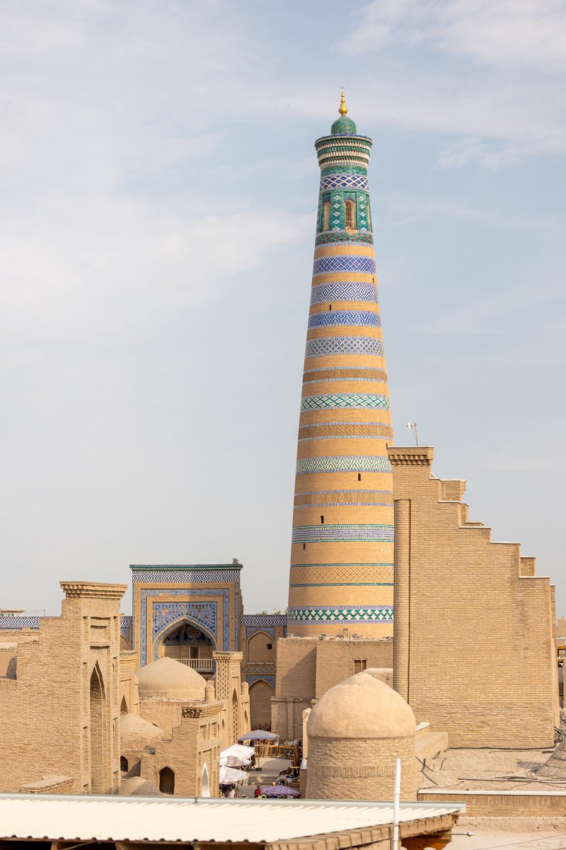 The tall striped Islam Khoja Minaret rising over Khiva, Uzbekistan