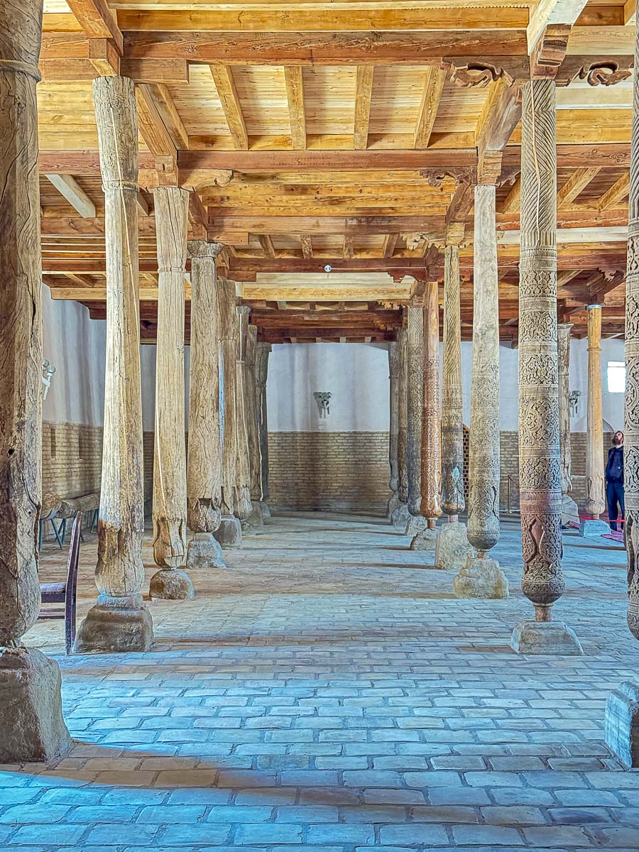 Carved wooden pillars inside Juma Mosque in Khiva, Uzbekistan