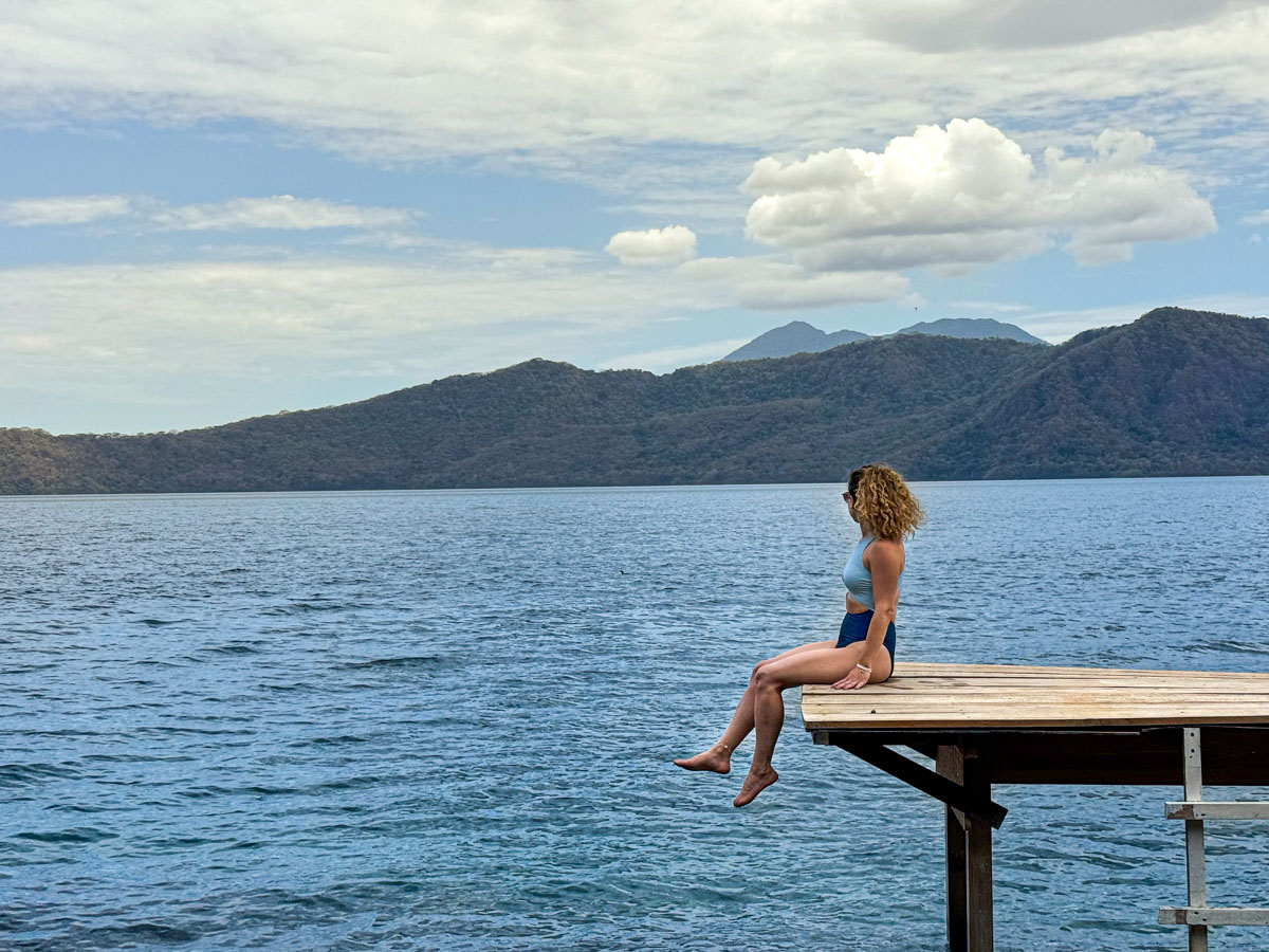 Nina on a private lakefront deck at Laguna de Apoyo, where most lake access is through hotels