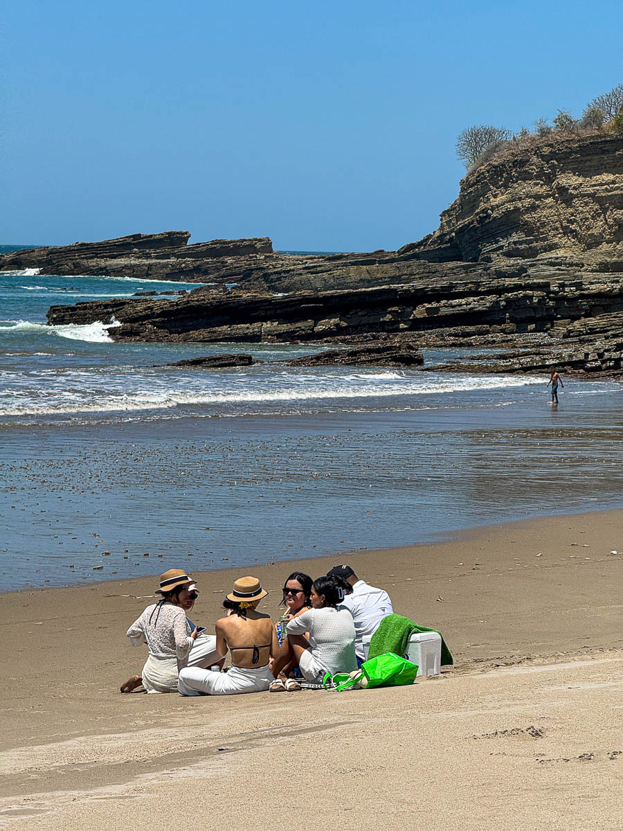 People relaxing on the sand at quiet Playa Marsella