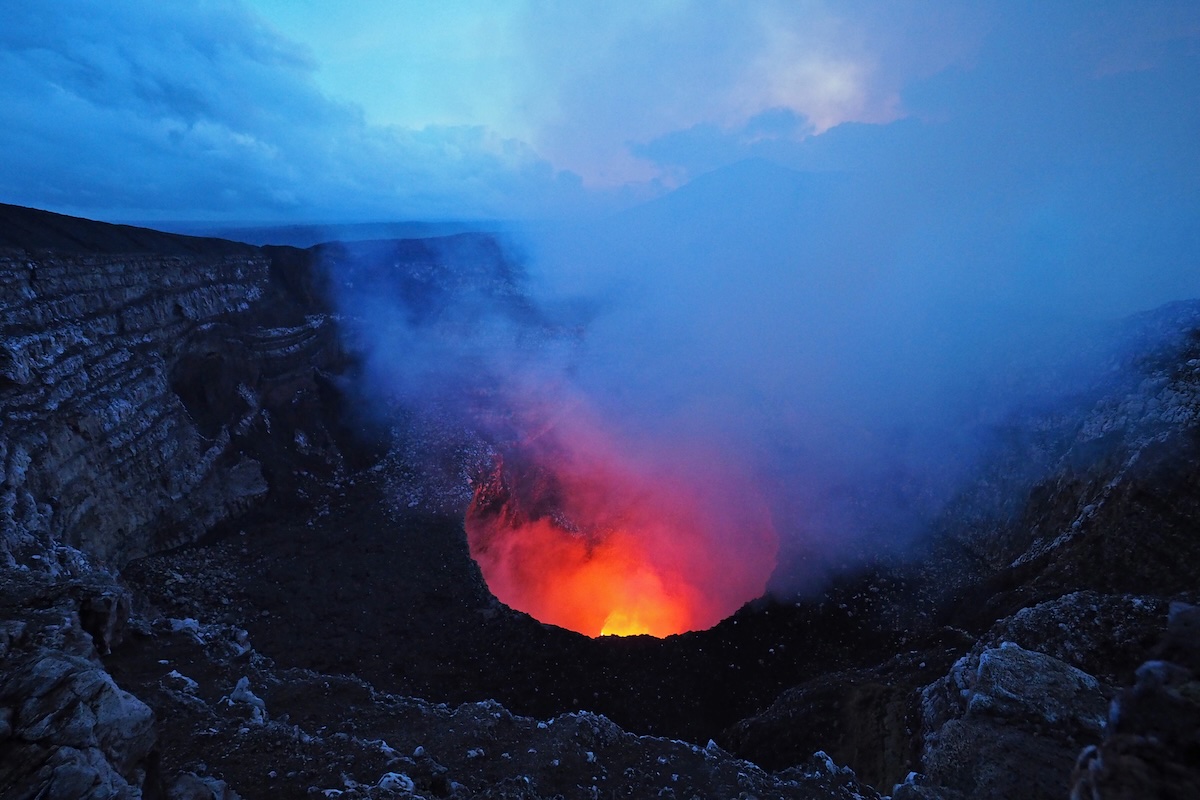 Older photo of the glowing lava lake inside Masaya Volcano's Santiago Crater at night