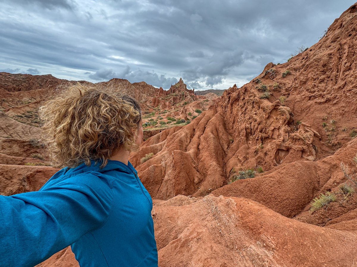 Nina looking out over the red rock formations of Fairytale (Skazka) Canyon, Kyrgyzstan
