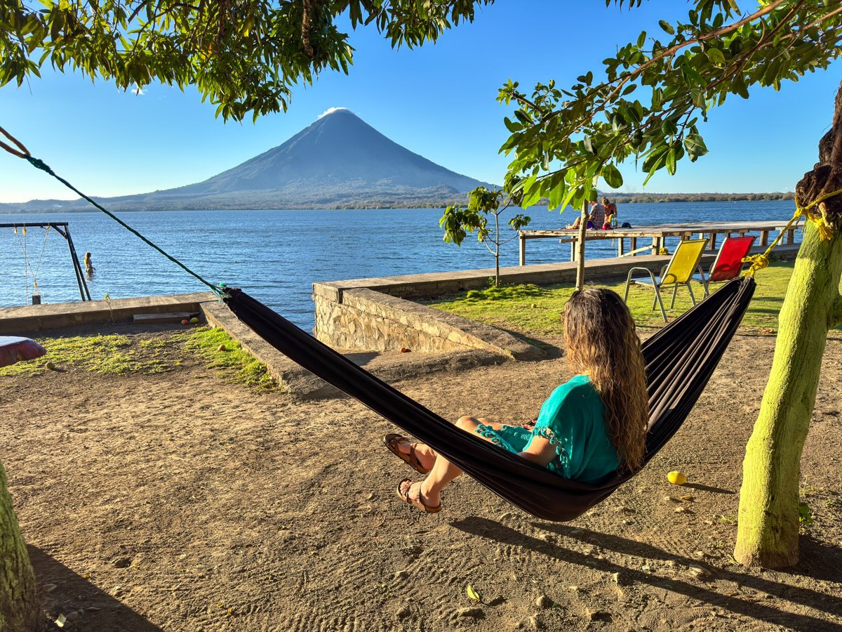Nina in hammock with volcano view in Ometepe, Nicaragua.