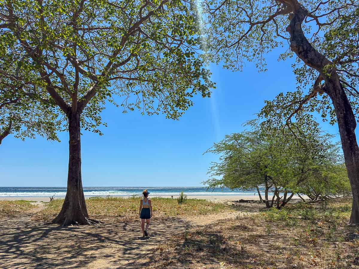 Nina walking down to remote Playa El Yankee near San Juan del Sur