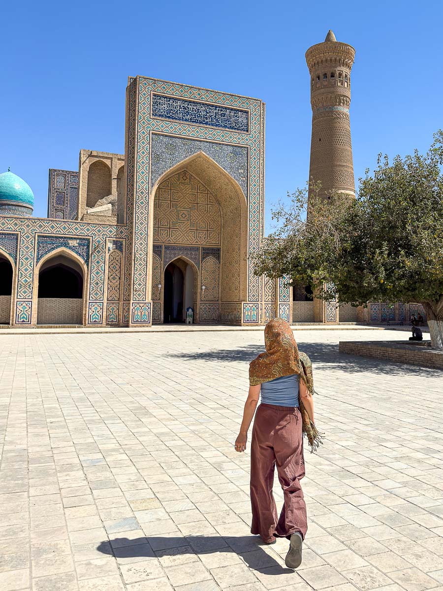 Nina walking at the Poi Kalon Complex in Bukhara, Uzbekistan