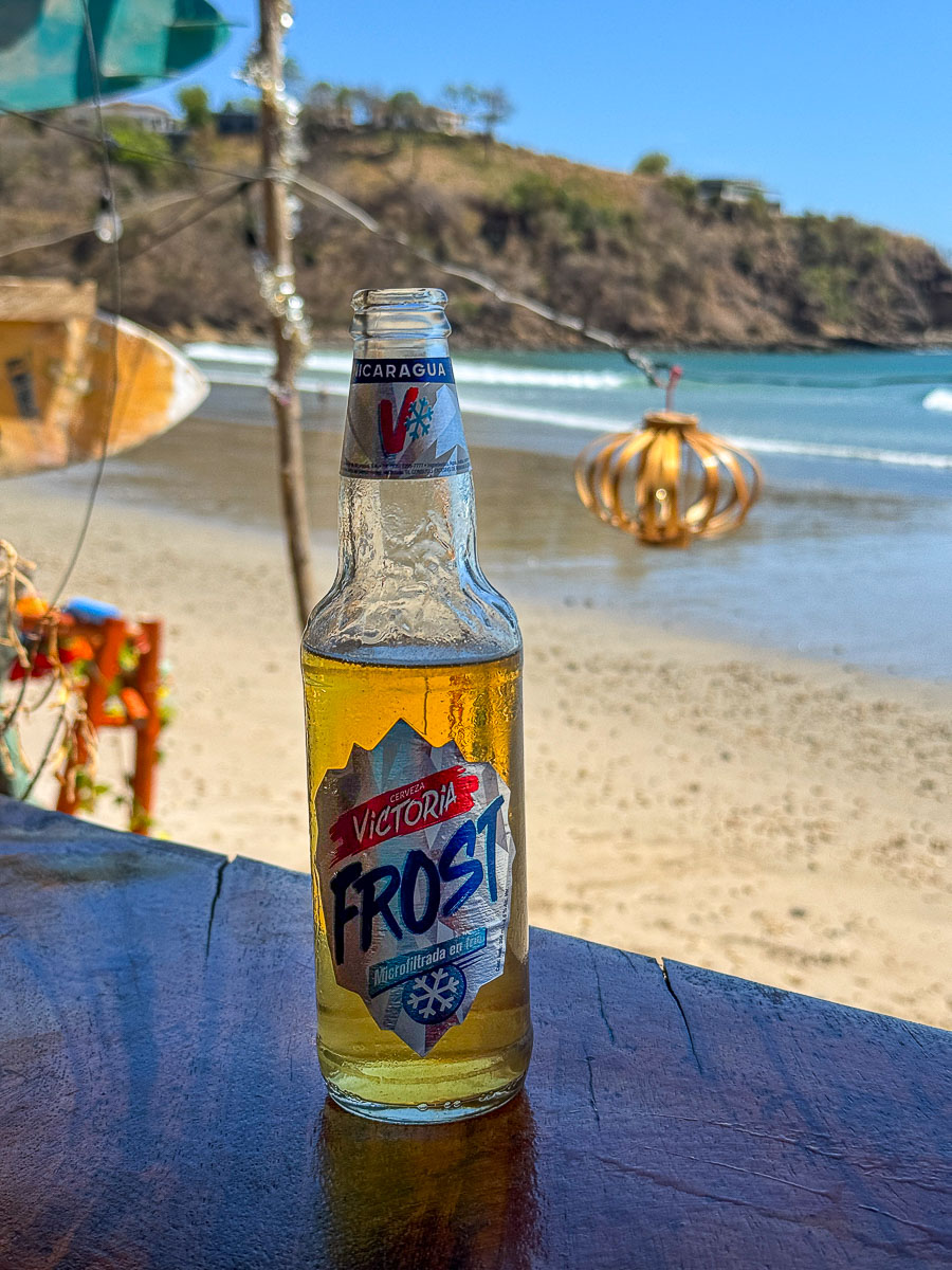 Cold beer on the sand at Playa Remanso, Nicaragua