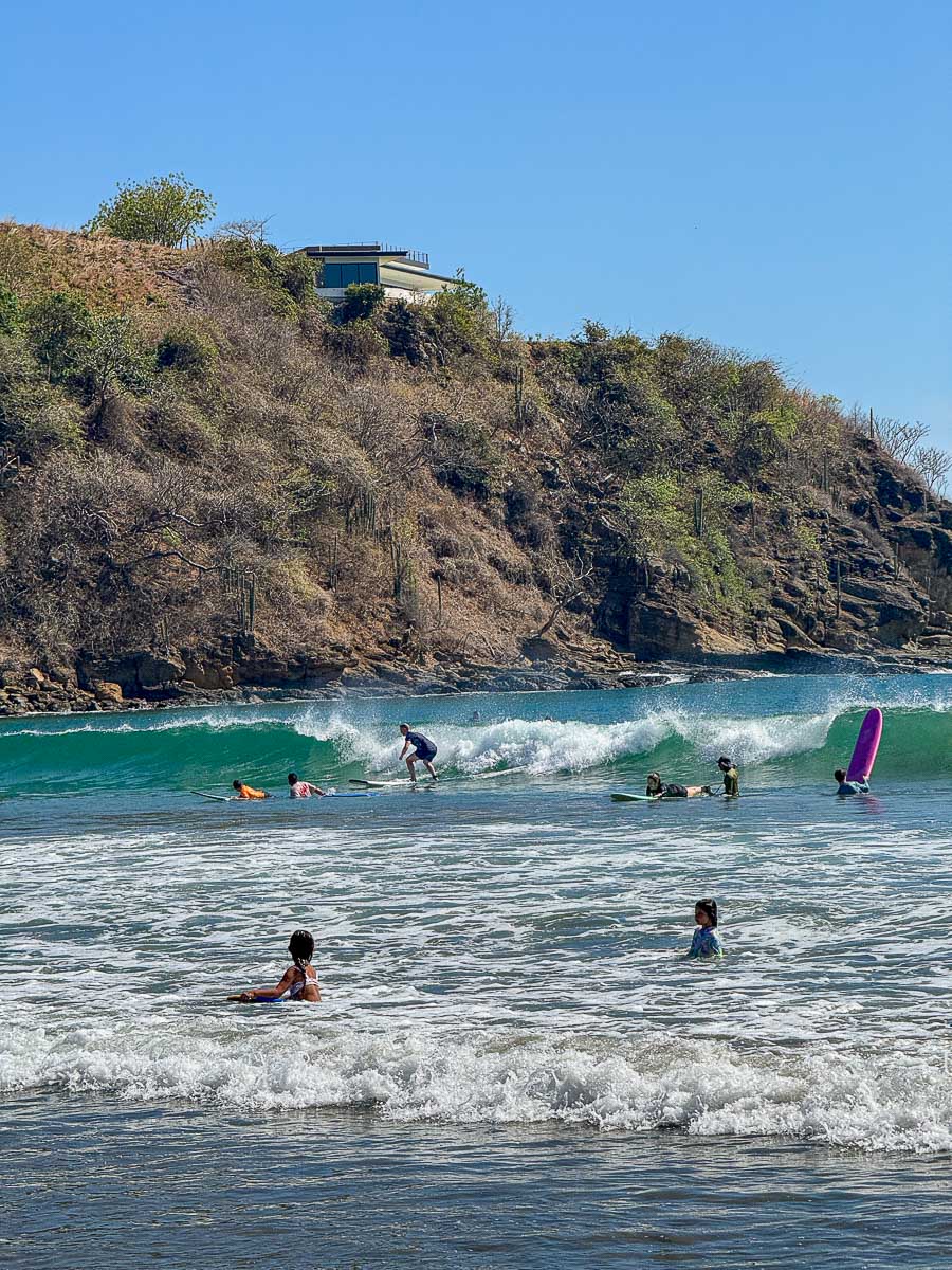 Surfer catching a wave at Playa Remanso, San Juan del Sur