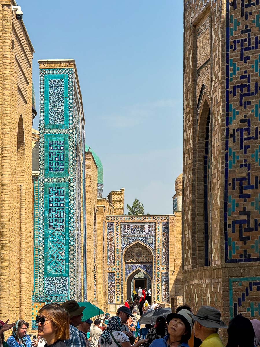 Walkway lined with blue tiled tombs at Shah-i-Zinda in Samarkand, Uzbekistan