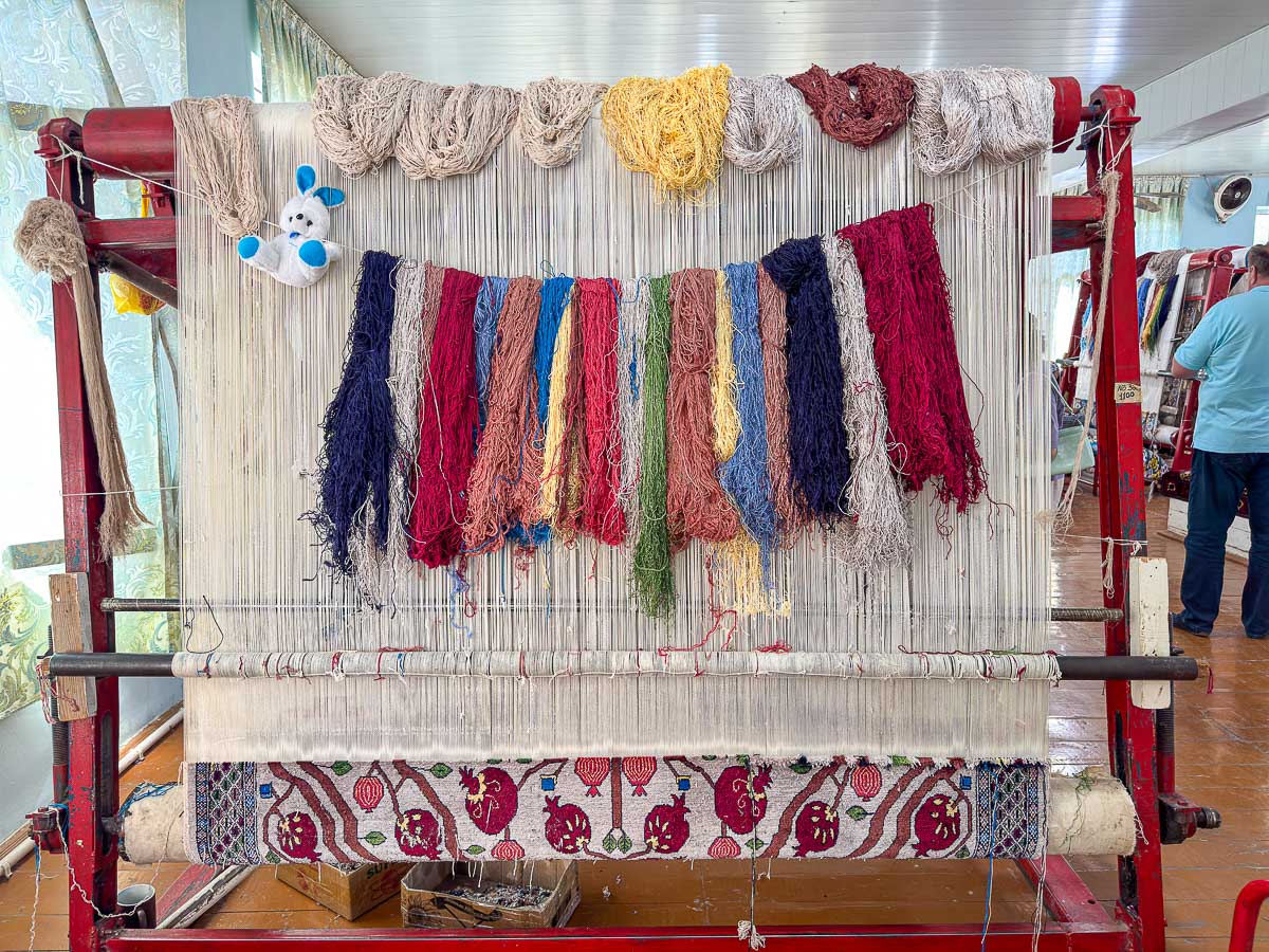 Hand-woven silk carpets at a workshop in Samarkand, Uzbekistan