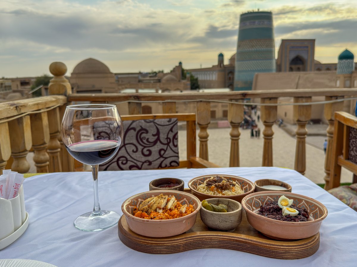 Wine and dinner on the rooftop at Terrassa Cafe overlooking Khiva, Uzbekistan