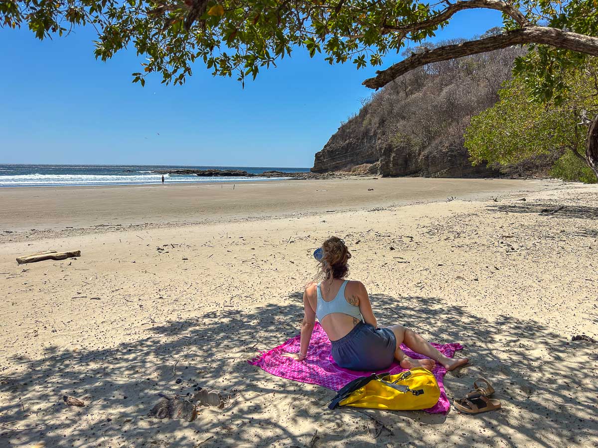 Nina on the empty sand at Playa El Yankee near San Juan del Sur
